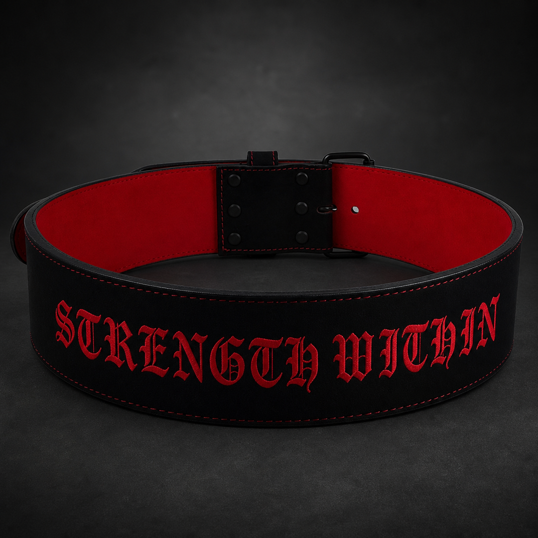 Black and red custom single-prong powerlifting belt with "STRENGTH WITHIN" text