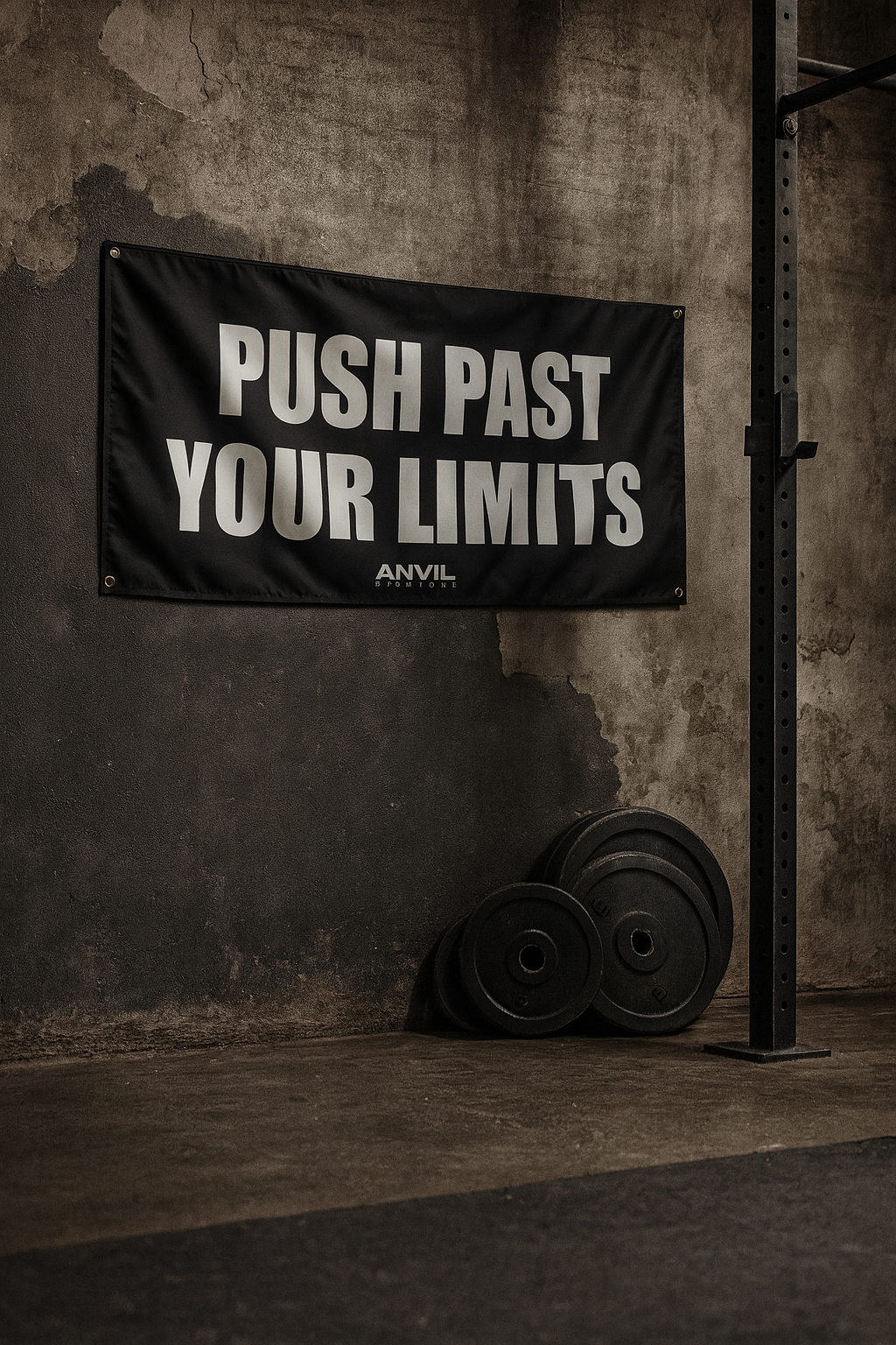 Motivational gym flag with inspirational text saying, "push past your limits". Black flag with white text in a home gym.