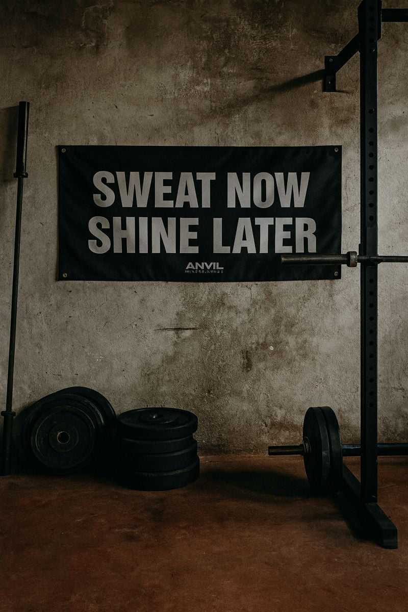 Motivational banner 'Sweat Now Shine Later' in a gym setting with weights and exercise equipment.