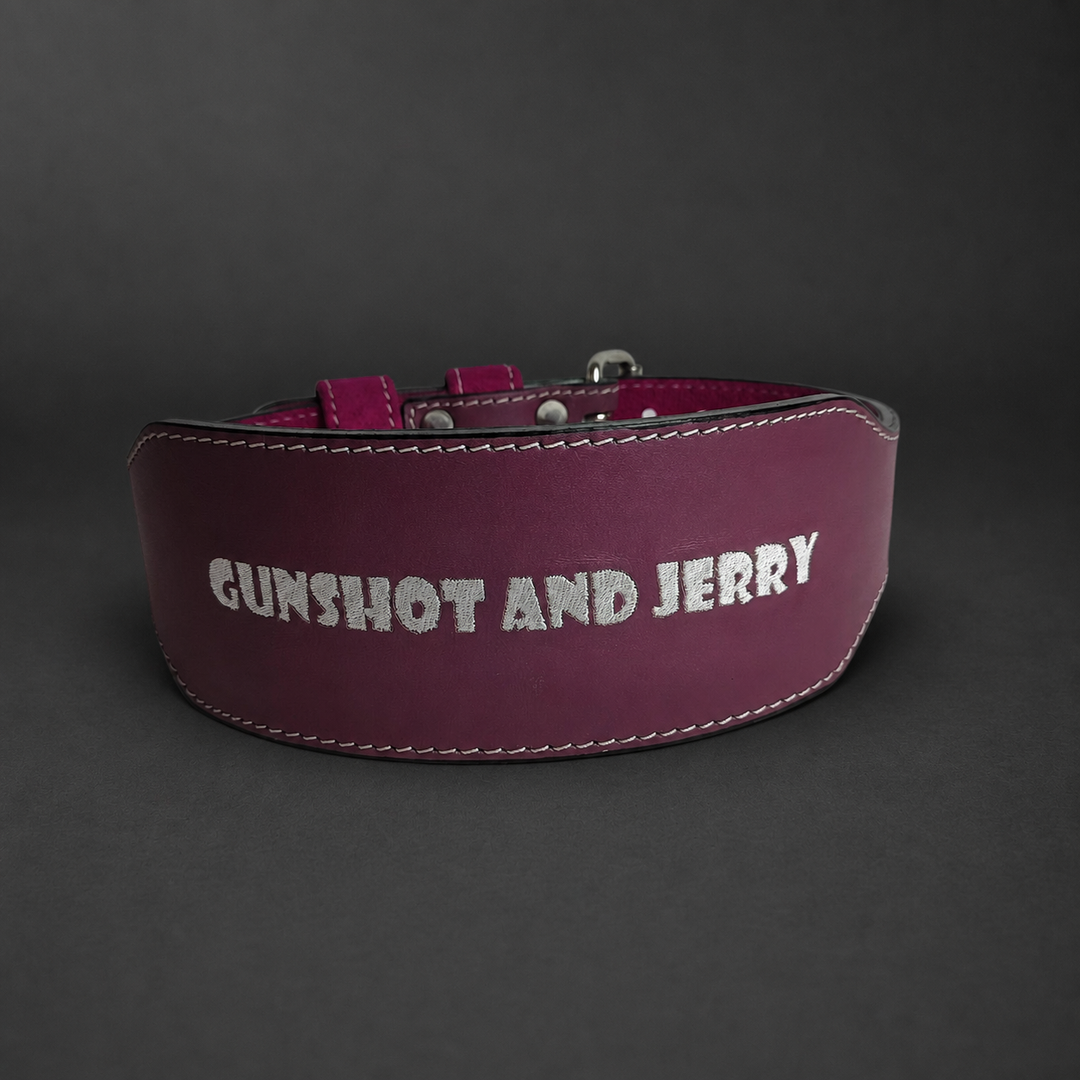 Burgundy and pink custom training belt with "GUNSHOT AND JERRY" text